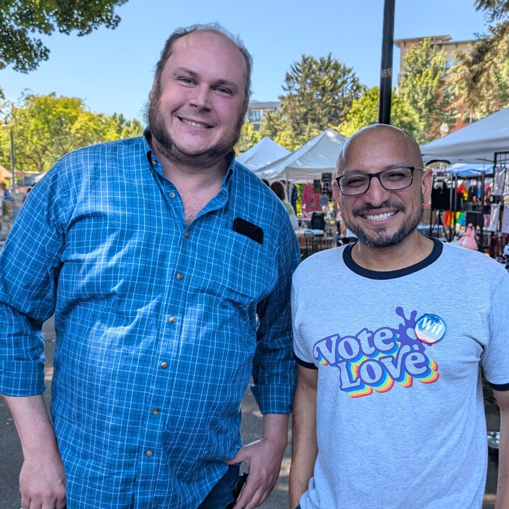 Vancouver Port Commissioner Eric Labrant and Wil Fuentes pose for a photo outdoors